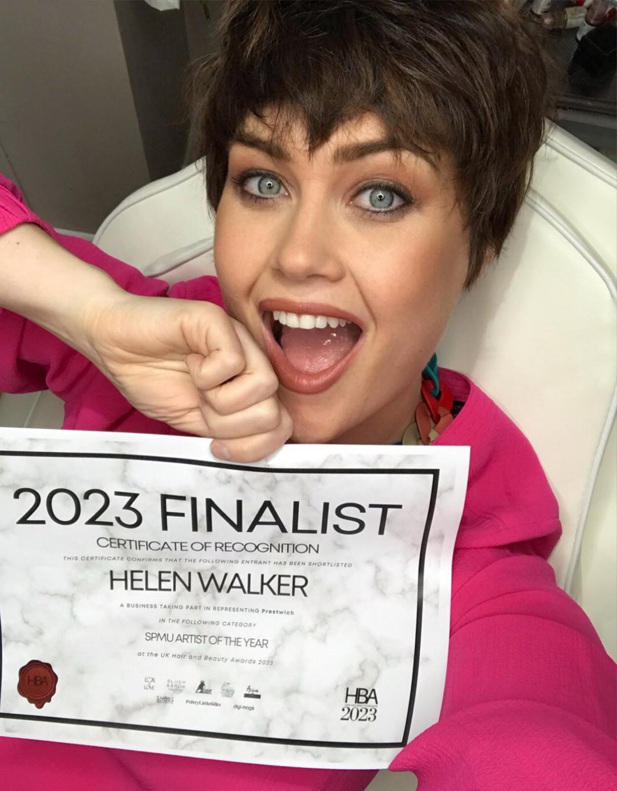 Helen Walker holding her 2023 English Beauty Awards Finalist certificate